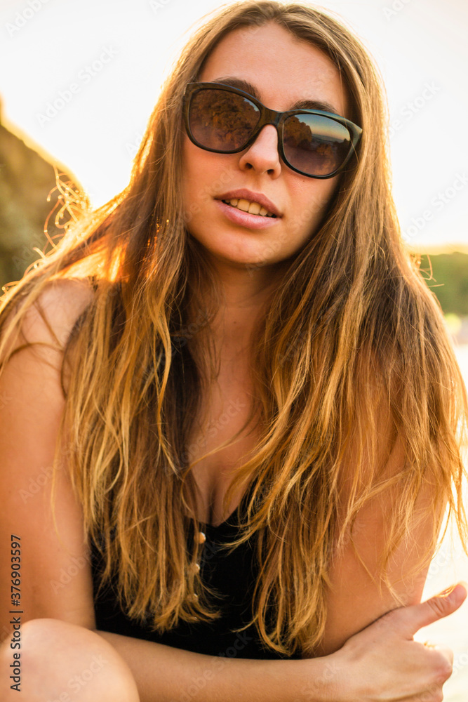 Close up portrait of lovely blond woman. Pretty happy lady enjoying summer outdoors. Positive emotion life success mind peace concept Close up portrait of lovely blond woman. Pretty happy lady enjoying summer outdoors. Positive emotion life success mind peace concept