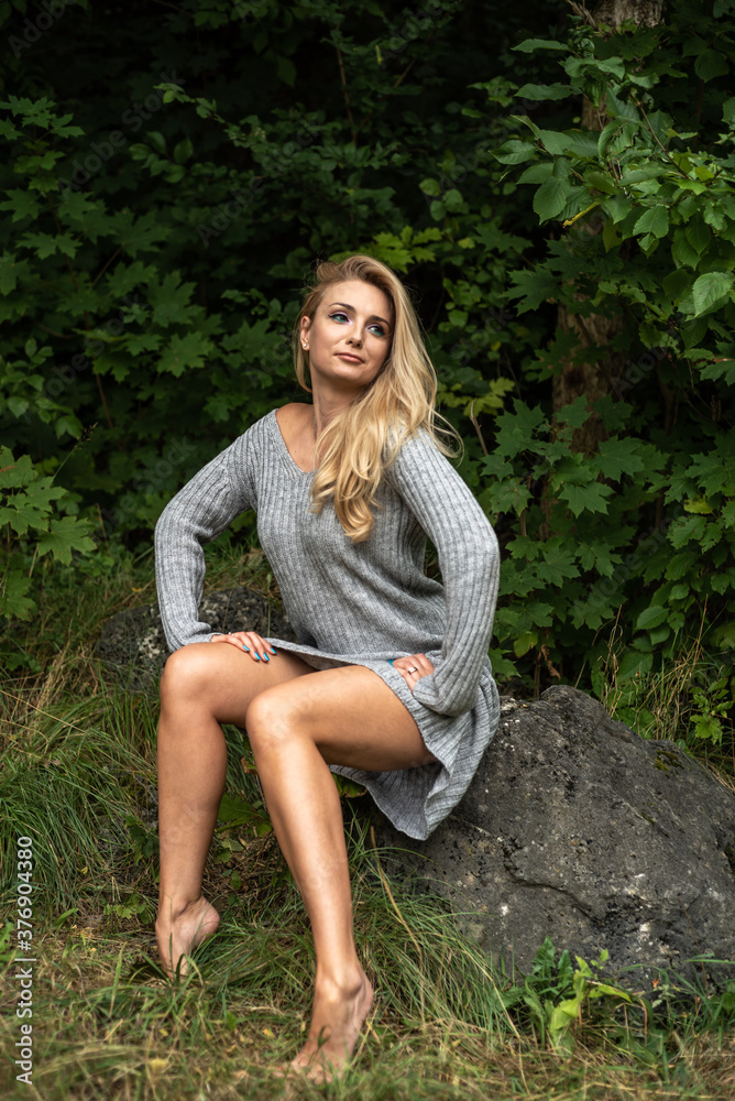 Close-up portrait of beautiful caucasian woman walking outdoors. Beautiful woman in a sweater. Fashion portrait stylish pretty woman outdoor.
