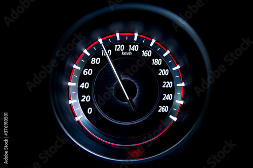 100 Kilometers per hour,light with car mileage with black background,number of speed,Odometer of car. photo