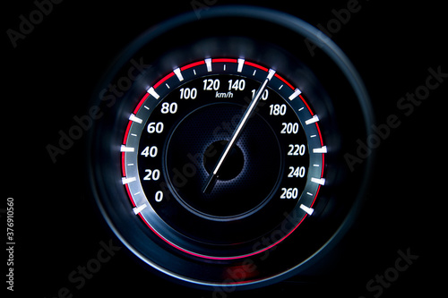 160 Kilometers per hour,light with car mileage with black background,number of speed,Odometer of car. photo