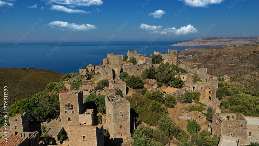 Obraz premium Aerial drone photo of picturesque abandoned old stone tower village of Vatheia overlooking deep blue sea in Mani Peninsula, Peloponnese, Greece