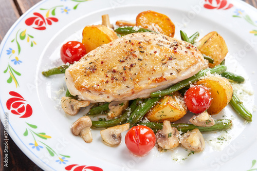 chicken fillet with fried vegetables