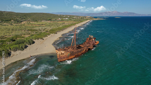 Aerial drone photo of old shipwreck left to rust ashore in Mediterranean destination bay
