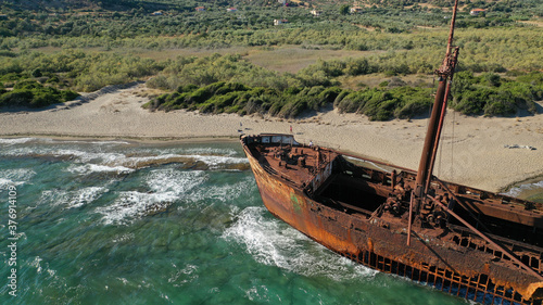 Aerial drone photo of old shipwreck left to rust ashore in Mediterranean destination bay