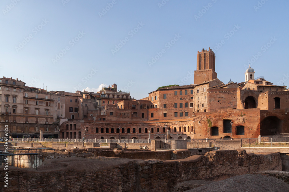 General view of the galleries, arches and buildings arranged in a semicircle, of Trajan's Market, in Trajan's forum, with the Militia Tower in the background, Rome.