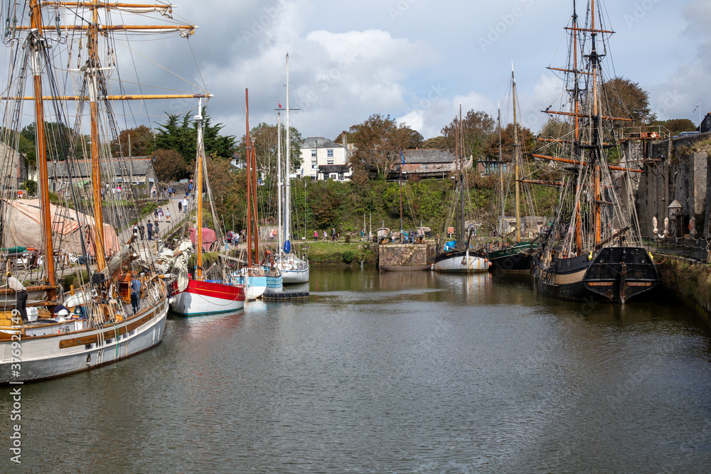 Old sailing ships in Charles town harbour Cornwall