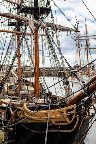 Old sailing ships in Charles town harbour Cornwall