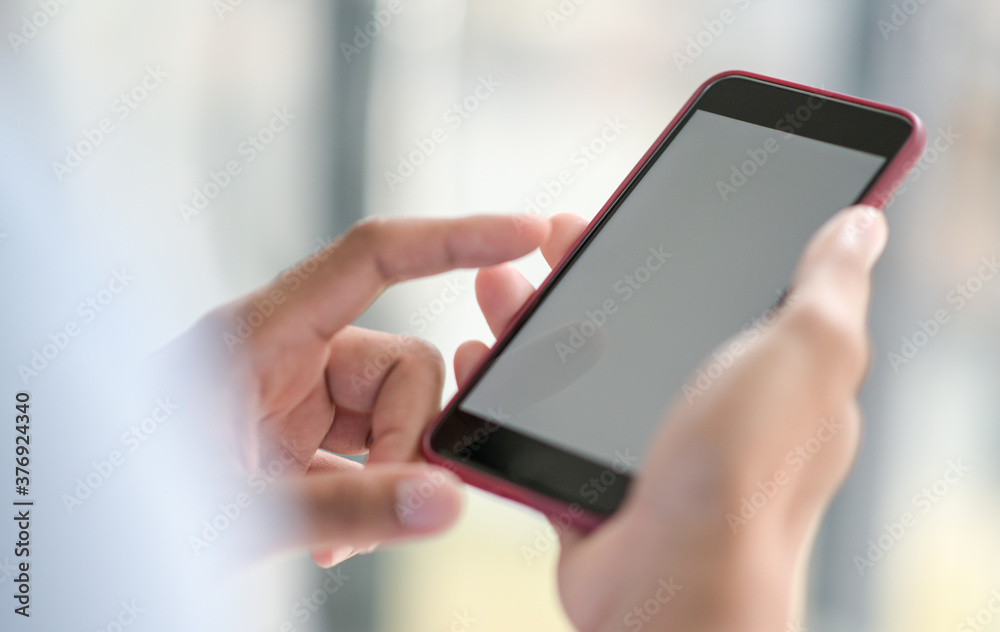 Close-up shot of A hand operating a smartphone.