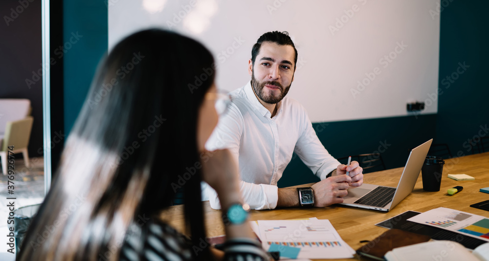Successful managers discussing business strategy in office Successful managers discussing business strategy in office
