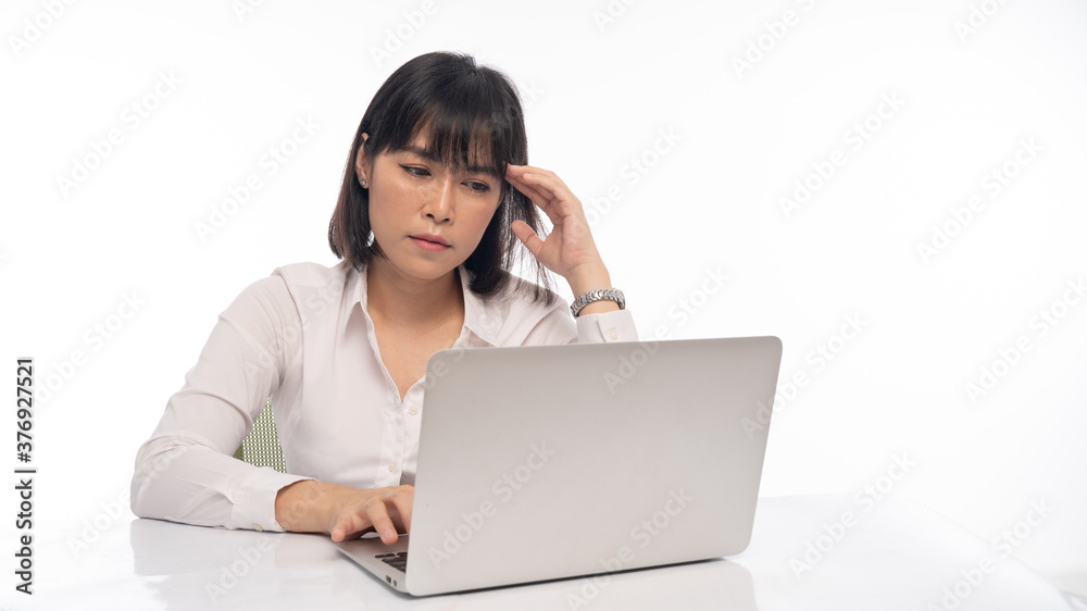 Office lady Working on laptop, stressed posture, working woman concept. Office lady Working on laptop, stressed posture, working woman concept.