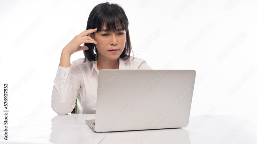 Office lady Working on laptop, stressed posture, working woman concept. Office lady Working on laptop, stressed posture, working woman concept.