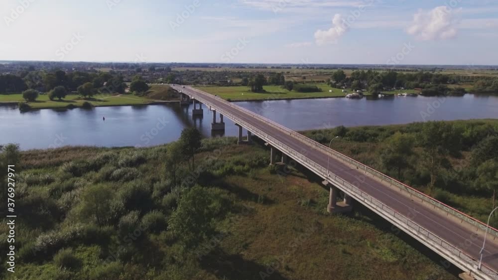 Atmata River and The Bridge to Rusne, Lithuania. Aerial Arc Left Atmata River and The Bridge to Rusne, Lithuania. Aerial Arc Left