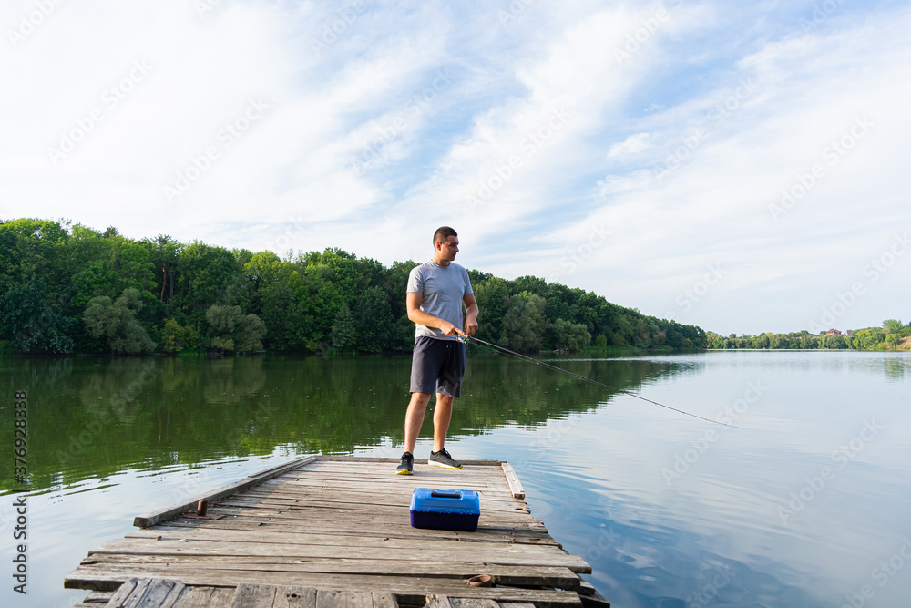 Young man fishing in the river