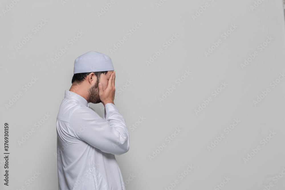 Portrait of smart handsome muslim man on white background,Ramadan festival concept