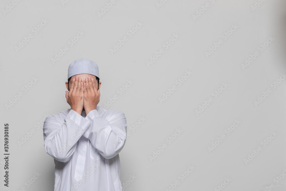 Portrait of smart handsome muslim man on white background,Ramadan festival concept