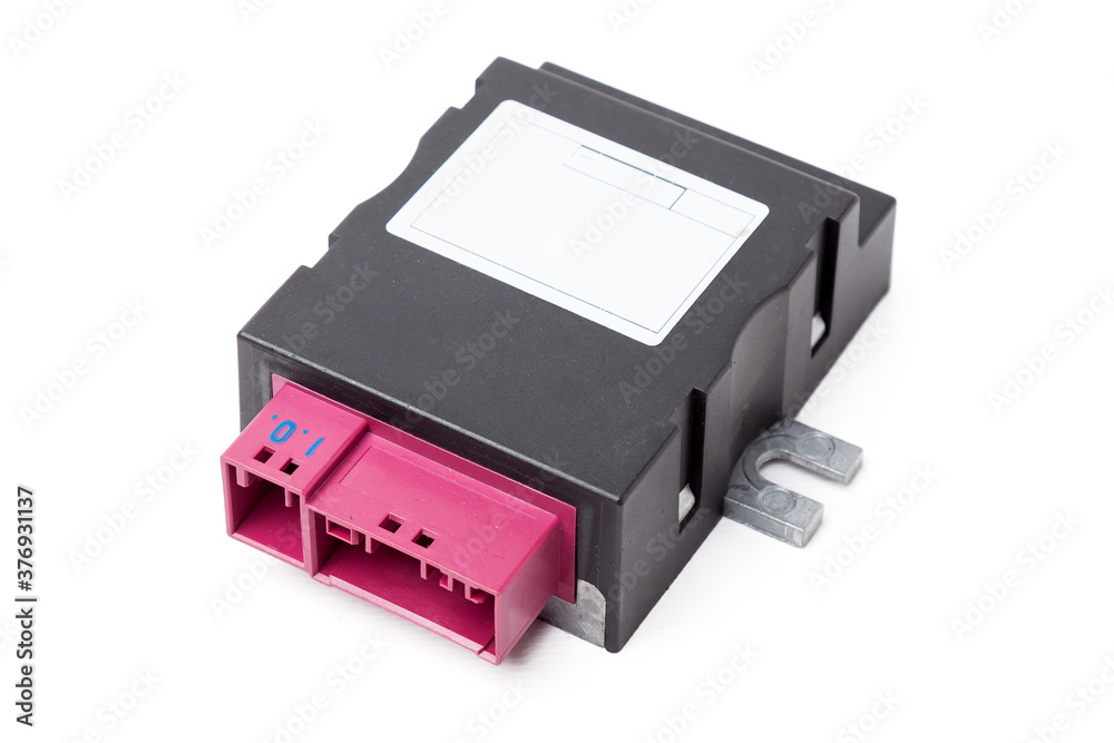 A spare part for a plastic car engine control unit in black with red elements on a white isolated background is a connecting center of subsystems, components and assemblies. Electronic ignition unit A spare part for a plastic car engine control unit in black with red elements on a white isolated background is a connecting center of subsystems, components and assemblies. Electronic ignition unit