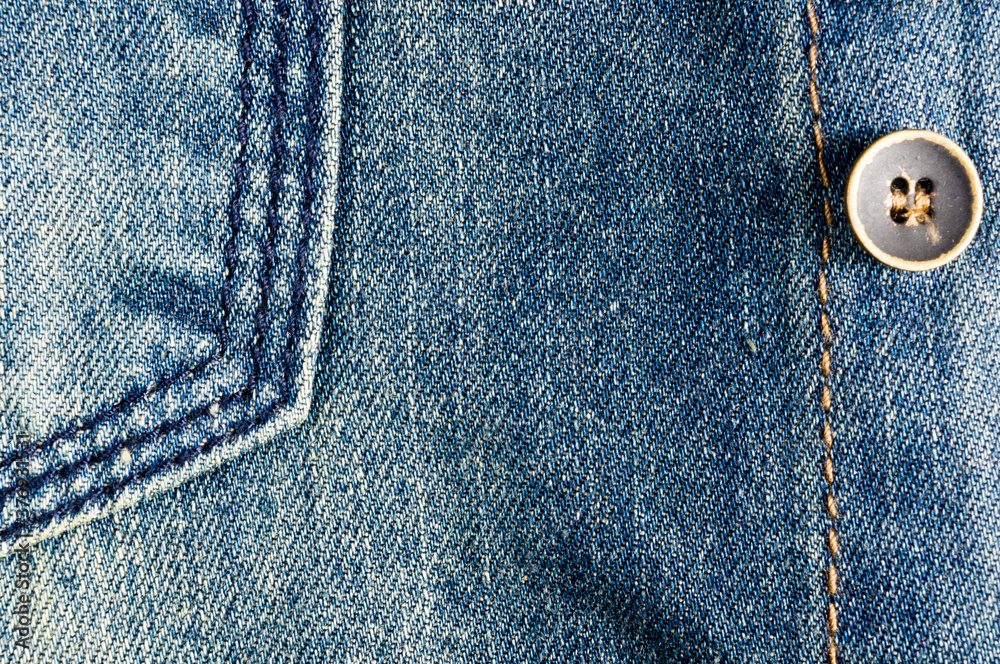 clothing items blue stonewashed faded jeans cotton fabric texture with seams, clasps, buttons and rivets, macro, close-up clothing items blue stonewashed faded jeans cotton fabric texture with seams, clasps, buttons and rivets, macro, close-up