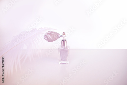 body schimmer dust in vintage bulb spray bottle, minimal design. crystal beauty dust. Softly shimmering glitter powder in a retro design bottle, natural makeup concept