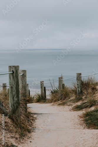 small wooden path leading to a beach