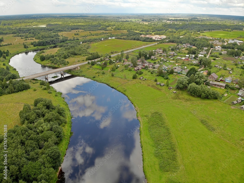 Aerial panorama view Borovichi city, Russia. Wide river bridge and wooden houses Aerial panorama view Borovichi city, Russia. Wide river bridge and wooden houses