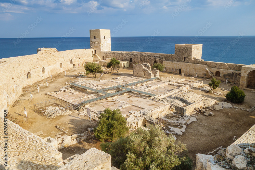 Panorama of medieval fortress Kizkalesi from tower. There are ruins of soldier barracks & chapel. All buildings have floor mosaics. Mediterranean sea on background. Shot in Kizkalesi, Turkey