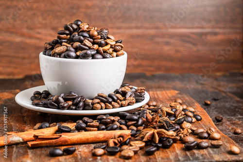 Coffee beans in the cup on the table