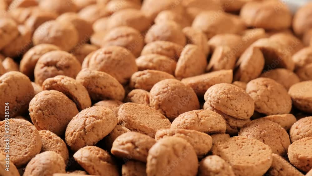 Background for Dutch holiday Sinterklaas with rotation kruidnoten, traditional sweets, strooigoed. St. Nicolas day concept. 4K video, 50 fps Background for Dutch holiday Sinterklaas with rotation kruidnoten, traditional sweets, strooigoed. St. Nicolas day concept. 4K video, 50 fps