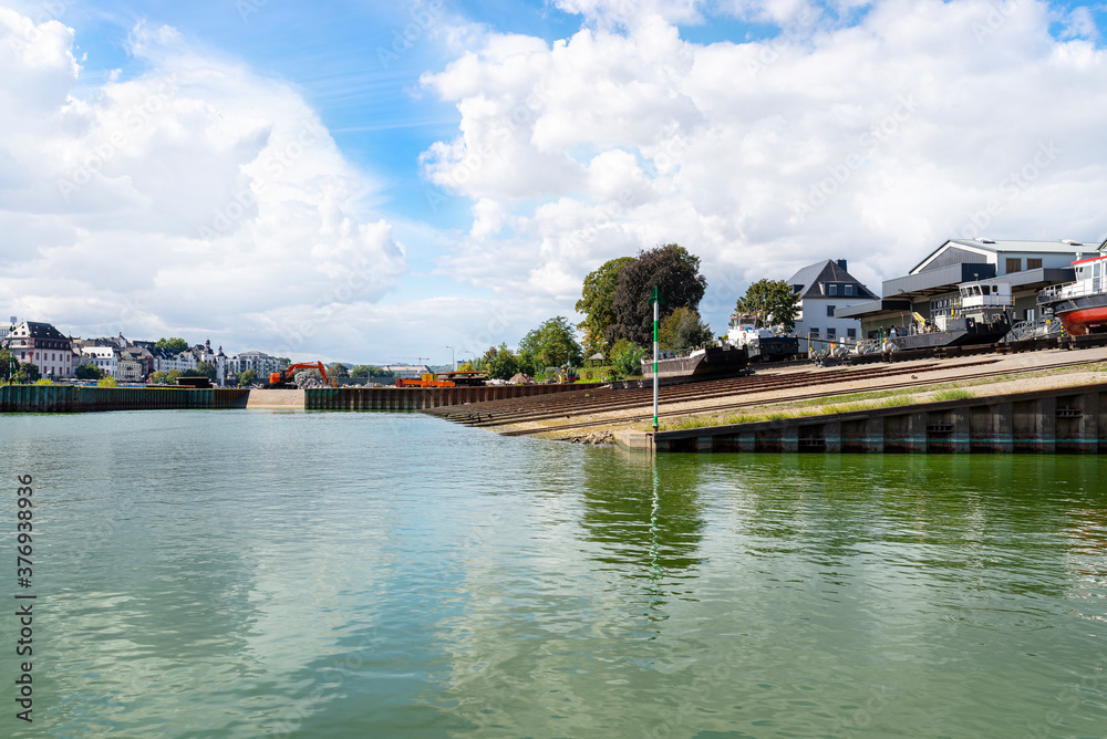 Dry dock with a slipway for launching ships in the channel by the river. Dry dock with a slipway for launching ships in the channel by the river.