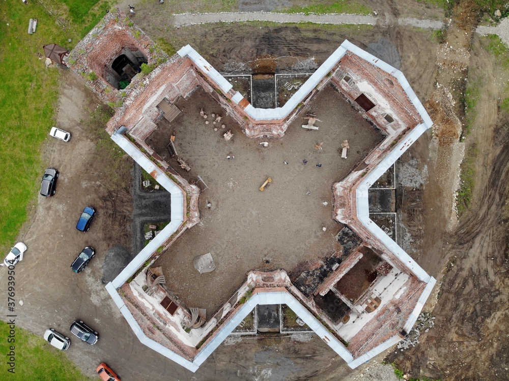 destroyed ruined church building without roof. Aerial view from top down Karelia