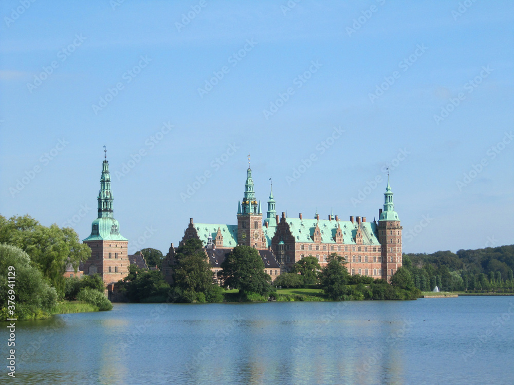 Red brick scandinavian castle on the lake, Denmark