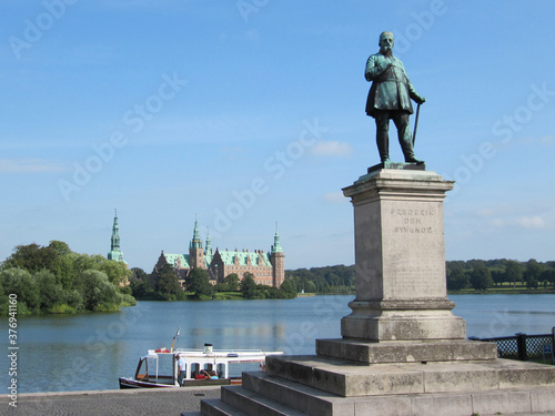 Scandinavian castle and statue on the lake, Denmark