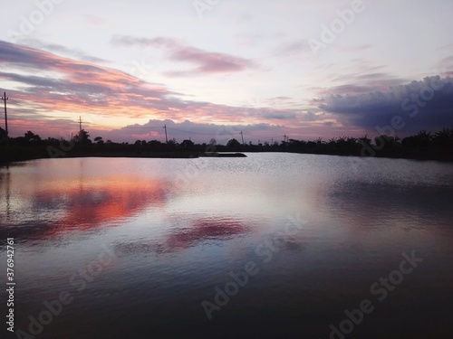 sunset over the lake © Abdmuid