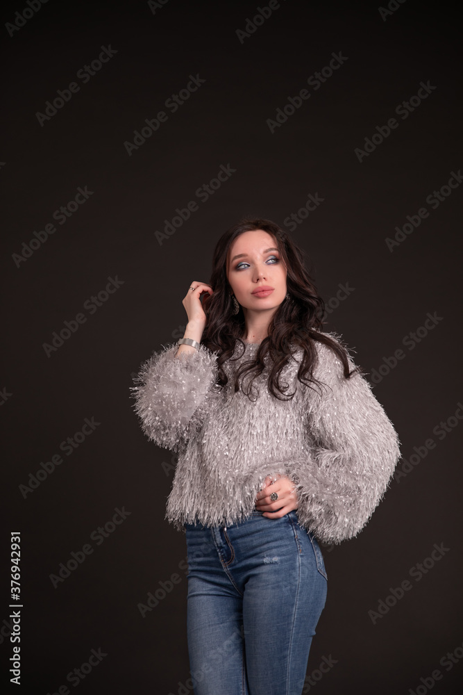Beautiful girl on a black background. copy space.vertical Beautiful girl on a black background. copy space.vertical