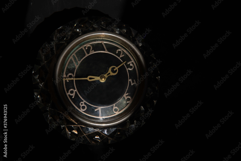 vintage clock on a black background