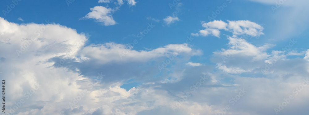 Panorama of blue sky with white clouds on a sunny day Panorama of blue sky with white clouds on a sunny day