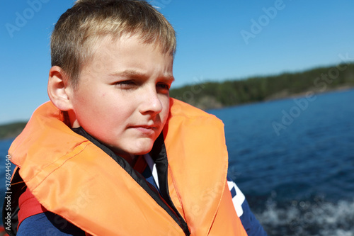 Child in life jacket in Ladoga skerries