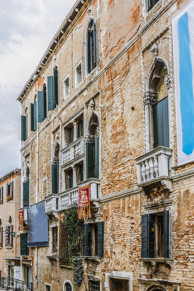 Beautiful view of Traditional Venetian buildings along a water channel, Venice, Italy, Europe.