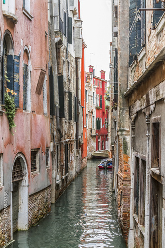 Beautiful view of Traditional Venetian buildings along a water channel, Venice, Italy, Europe. © dbrnjhrj