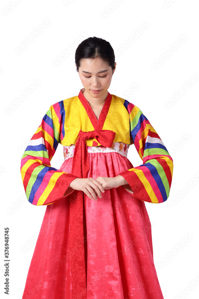 A beautiful Asian woman wearing hanbok is the national dress of Korea. White background. isolated. Clipping path A beautiful Asian woman wearing hanbok is the national dress of Korea. White background. isolated. Clipping path
