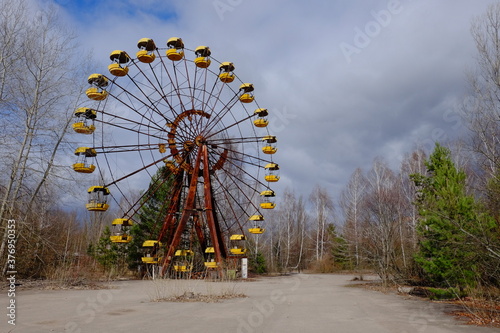 The famous Ferris wheel in an abandoned amusement park in Pripyat. Cloudy weather in the Chernobyl exclusion zone.
