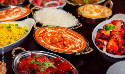 assorted indian curry and rice dishes