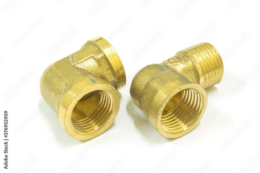 90 Degree brass elbow fitting on white background, Isolated. 90 Degree brass elbow fitting on white background, Isolated.