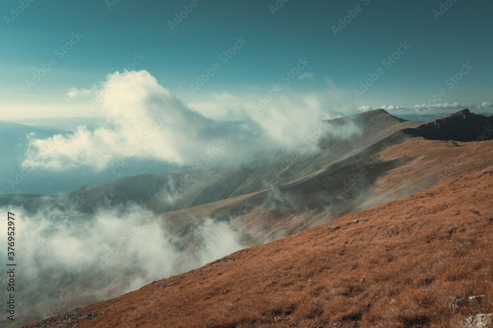 Amazing clouds landscape on the mountain in autumn season 