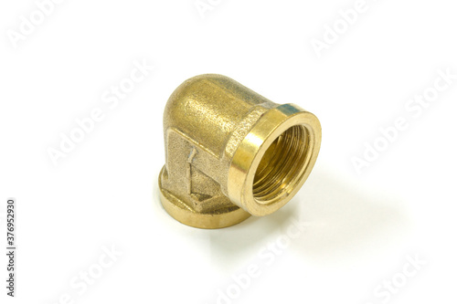 90 Degree brass elbow fitting on white background, Isolated.