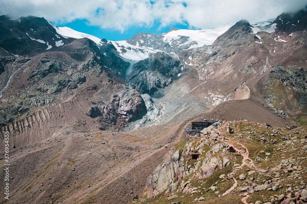 An isolated mountain refuge in the middle of the valley in the italian Alps (Trentino, Italy, Europe) An isolated mountain refuge in the middle of the valley in the italian Alps (Trentino, Italy, Europe)