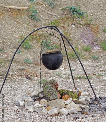 black kettle for campfire on tripod