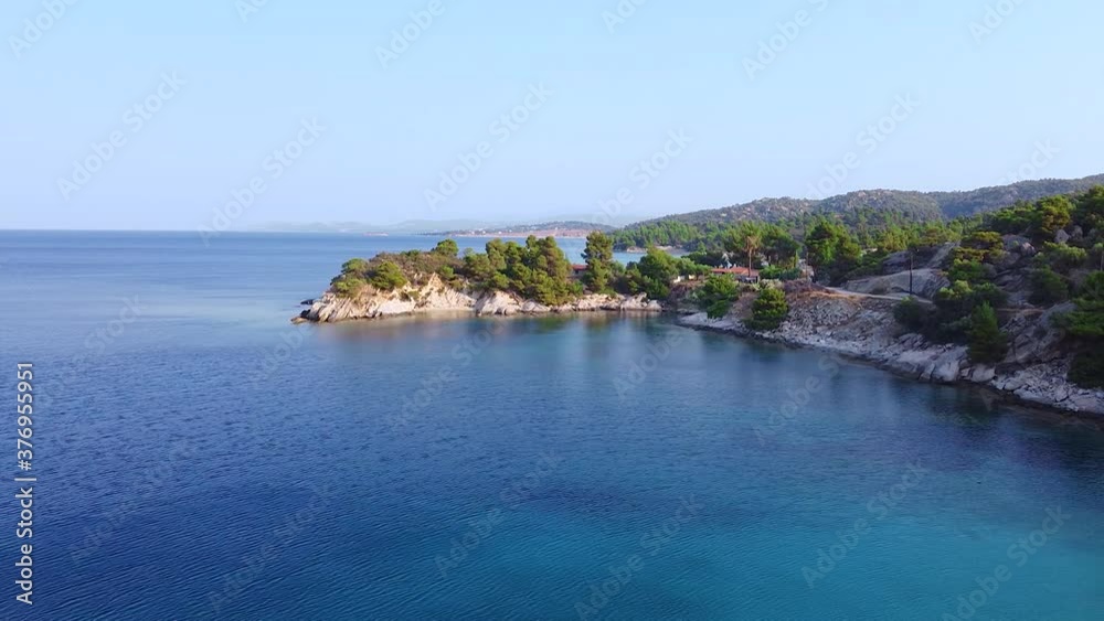 Aerial view of turquoise and clear Aegean sea and coast in summertime Aerial view of turquoise and clear Aegean sea and coast in summertime