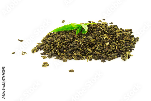Heap of tea with green leaf plant isolated on white background