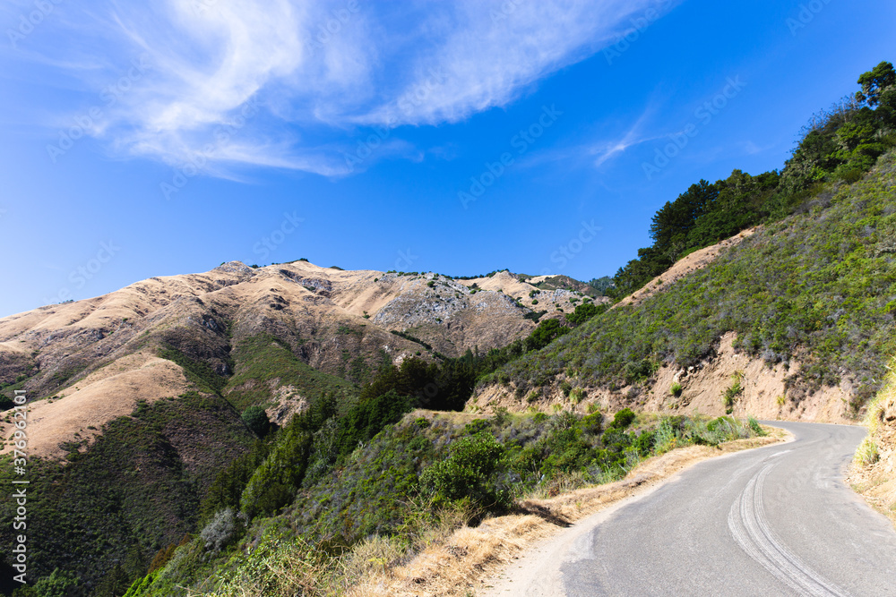 very small road on a mountain in summer