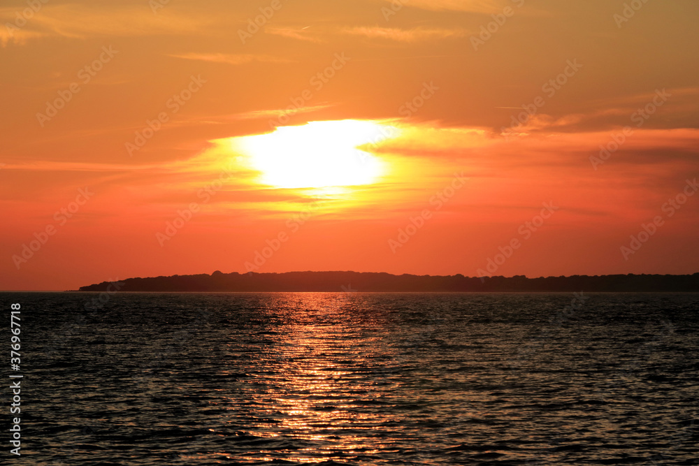 orange sundown in Fazana, Croatia orange sundown in Fazana, Croatia